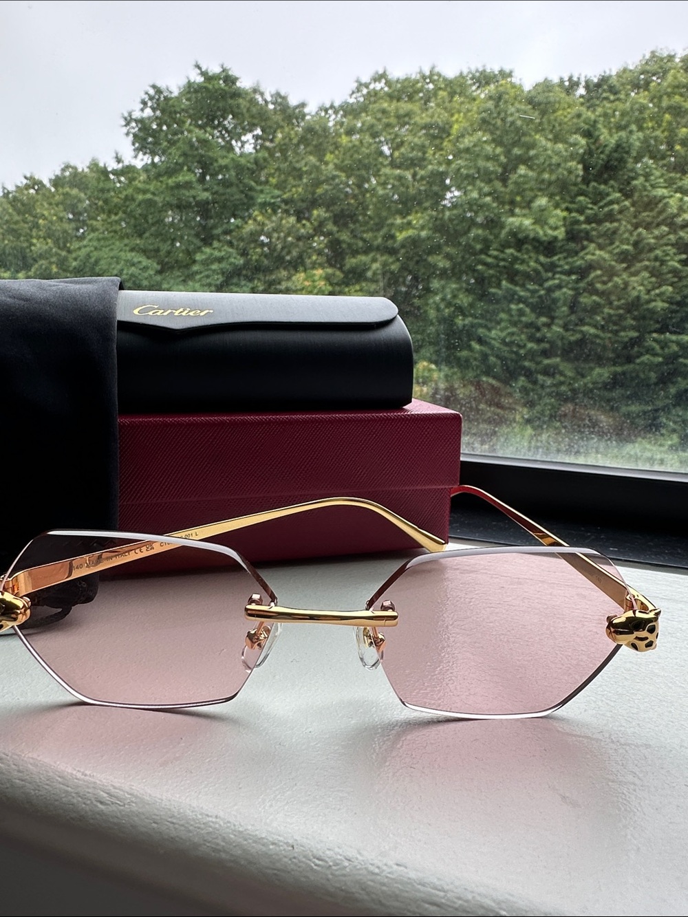 Cartier Gold-Trim Rimless Sunglasses with Pink Lenses